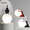 Axya Humanoid Ball Holder Table Lamp