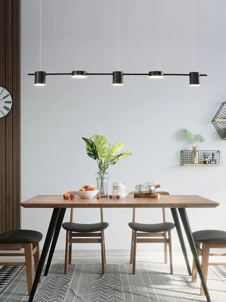 Axya minimalist LED pendant light perfect for dining room, bar, and restaurant tables.