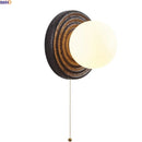 Axyaa White Glass Ball LED Wall Sconce Black Travertine Light Fixture