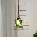 Axyaa Amber Glass LED Pendant Light with Walnut Handle for Modern Décor.