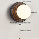 Axyaa White Glass Ball LED Wall Sconce Black Travertine Light Fixture