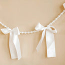 Axyaa White Bow Satin Ribbon and Pearl Garland for Wedding Party Decoration