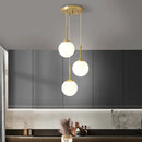 Axyaa Nordic Brass Bedside Pendant Lamp - Modern Glass Sphere for Bedroom & Bar Counter.