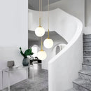 Axyaa Nordic Brass Bedside Pendant Lamp - Modern Glass Sphere for Bedroom & Bar Counter.