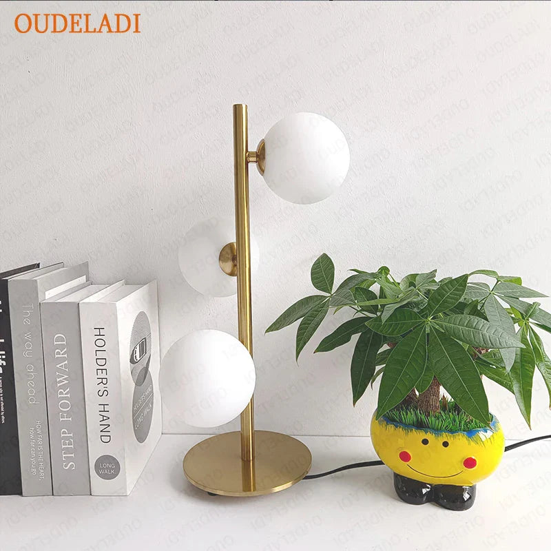 Axya Nordic Glass Ball LED Table Lamp in Gold & Black Iron Art