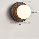 Axyaa White Glass Ball LED Wall Sconce Black Travertine Light Fixture