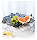 Axyaa Melon Seed & Fruit Plate Set on Crystal Glass Coffee Table