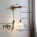Axyaa Wabi Sabi Clear Glass LED Wall Lamp with Vintage Brass Socket
