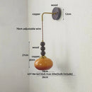 Axyaa Vintage Glass Ball LED Wall Sconce - Adjustable Amber Light Fixtures