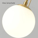 Axyaa Nordic Brass Bedside Pendant Lamp - Modern Glass Sphere for Bedroom & Bar Counter.