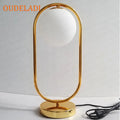 Axyaa Gold Metal Base Glass Ball LED Desk Lamp - Art Decor Statement Piece