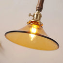 Axyaa Amber Glass LED Pendant Light with Walnut Handle for Modern Décor.
