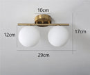 Axyaa Round Glass Wall Lights | Dual & Triple Head for Bedroom, Bathroom