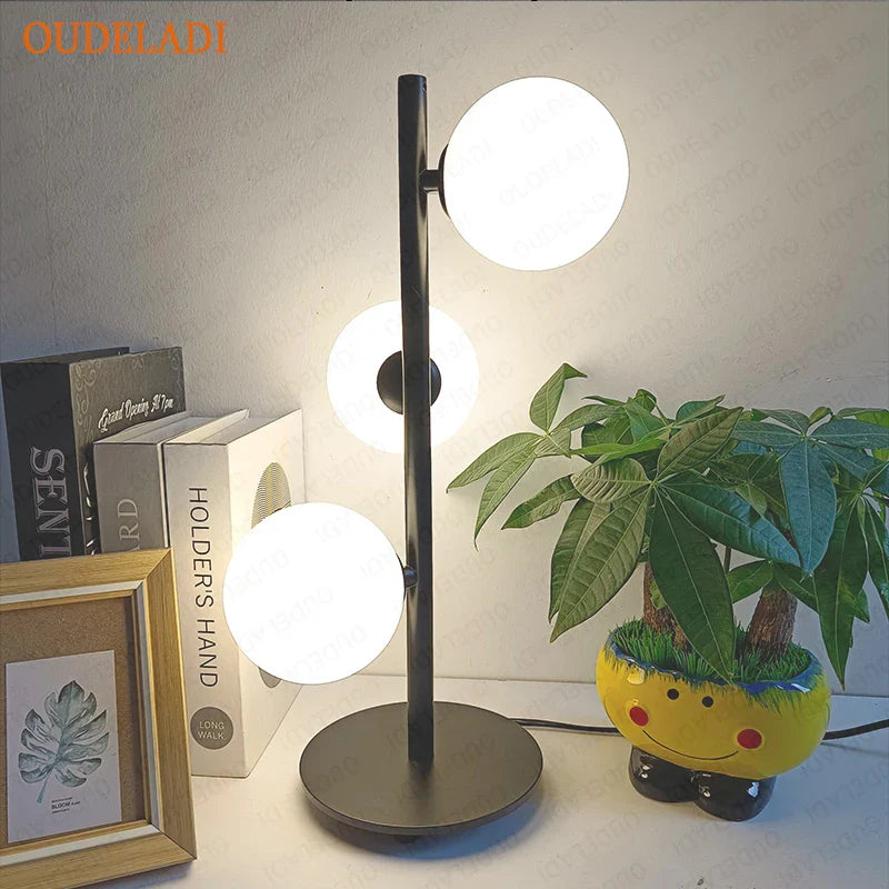 Axya Nordic Glass Ball LED Table Lamp in Gold & Black Iron Art