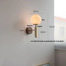 Axyaa Globe White Glass LED Wall Sconce Copper Base Mirror Light