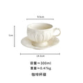 Axyaa Ceramic Gold Painted Tea Cup Set glamorizes afternoon tea styling
