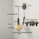 Axyaa Vintage Glass Ball LED Wall Sconce - Adjustable Amber Light Fixtures