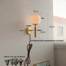 Axyaa Globe White Glass LED Wall Sconce Copper Base Mirror Light