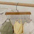 Axyaa 8-Hook Wooden Clothes Hanger for Home Storage and Organization.