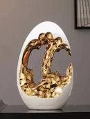 Axyaa Luxury Gold & Silver Egg Decorations: Modern, High-End Décor for Living Rooms & Offices.